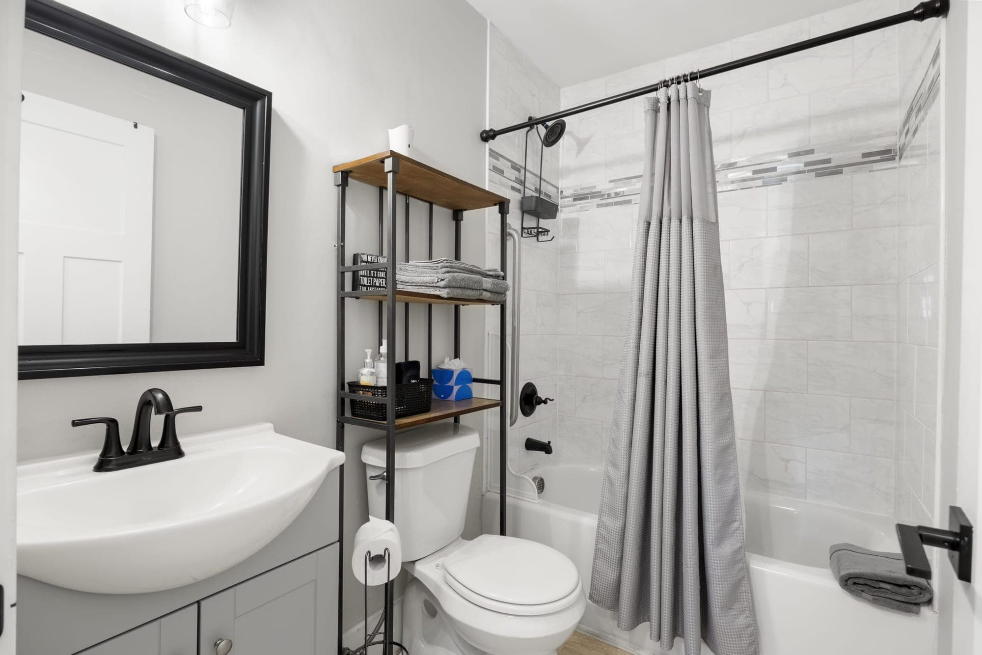 Bathroom with a tub and shower
