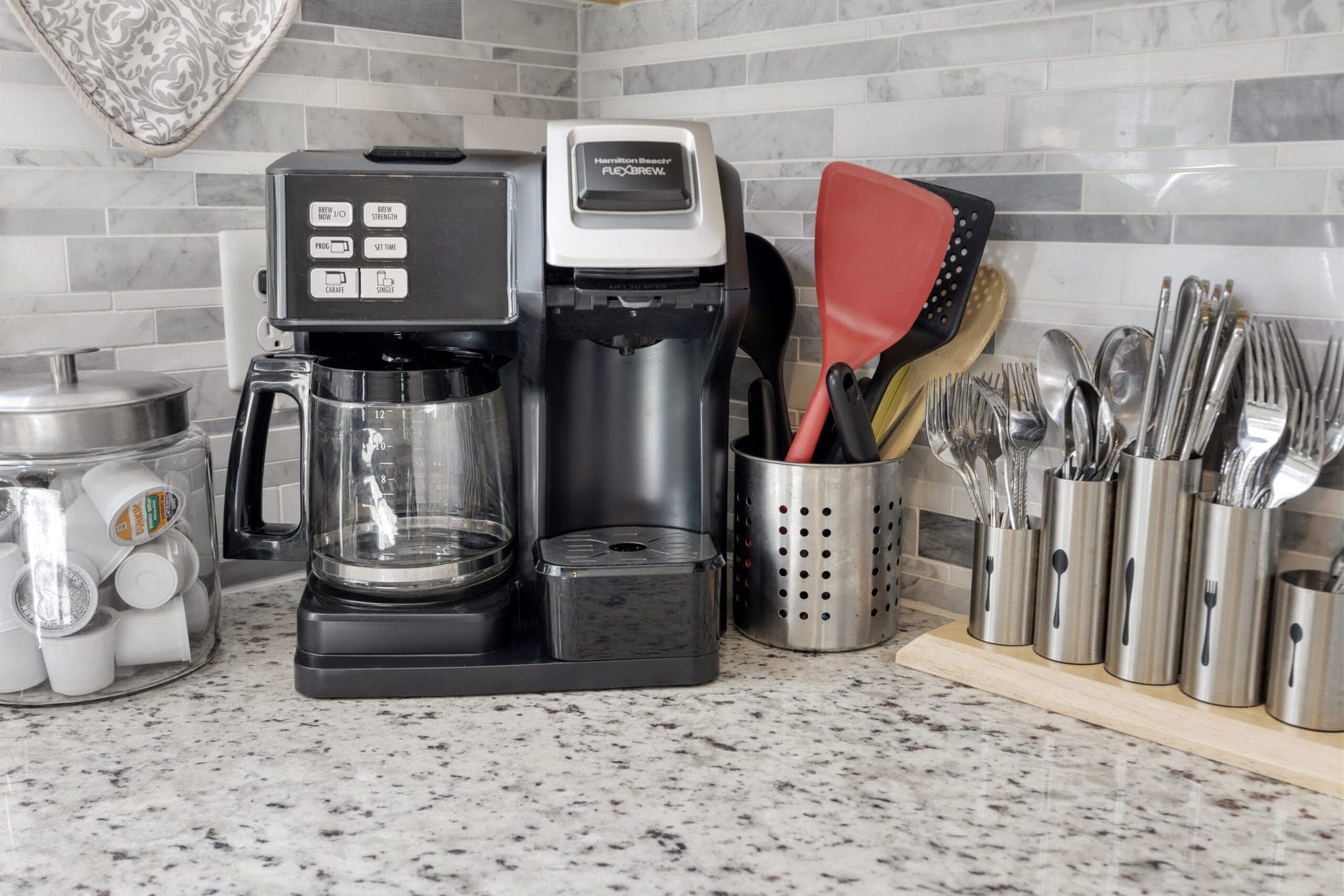 Coffee maker and utensils on the counter