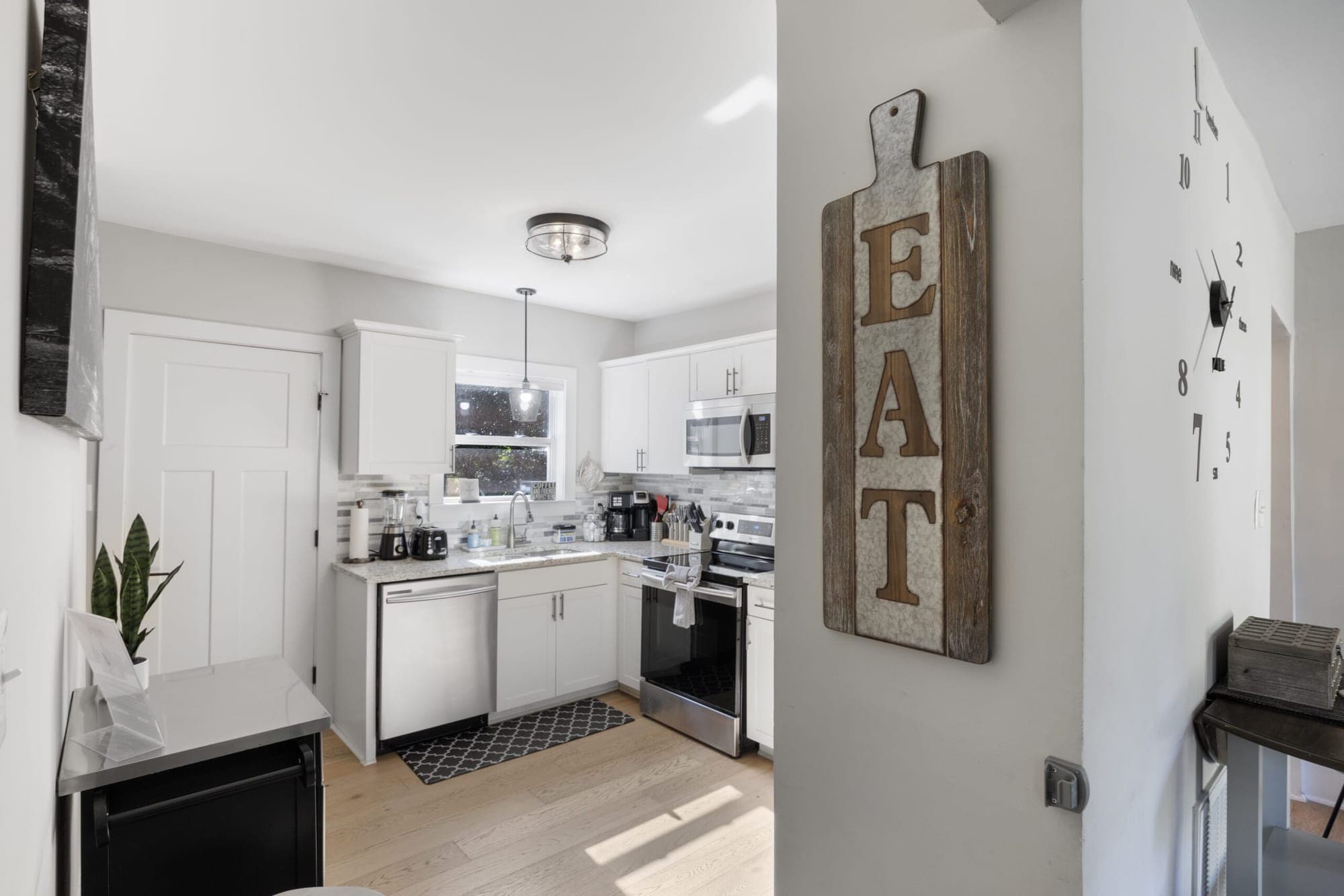 View into the kitchen past an EAT sign