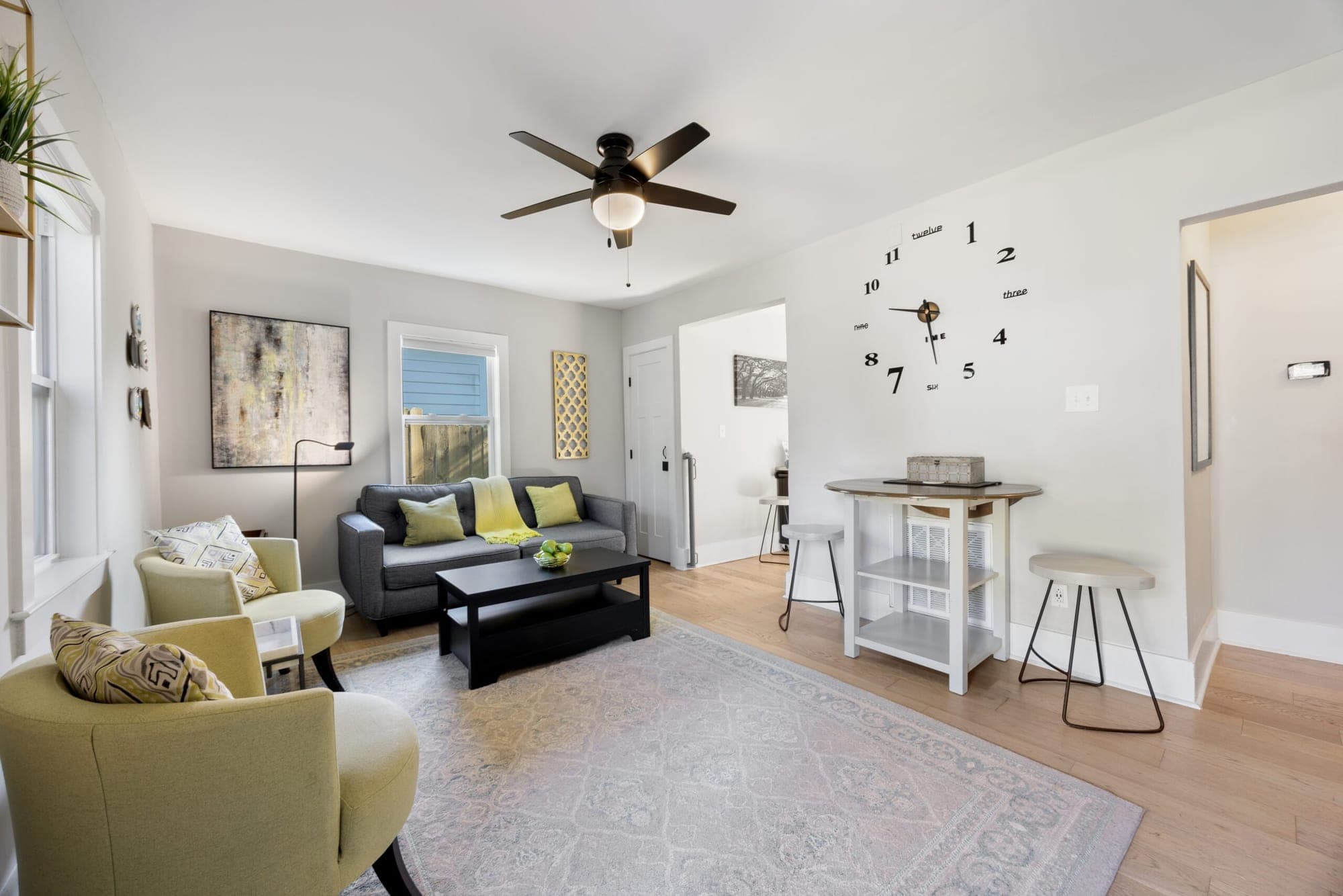 Living room with yellow armchairs, a gray sofa and coffee table