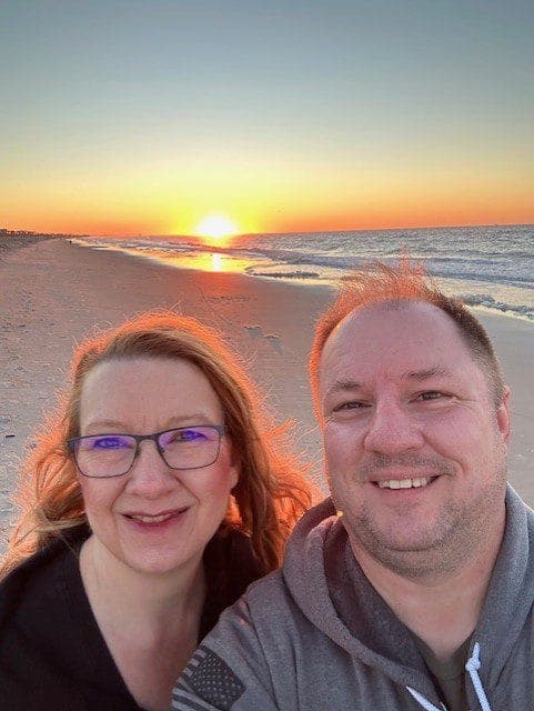 Michelle and Carson on the beach at sunset