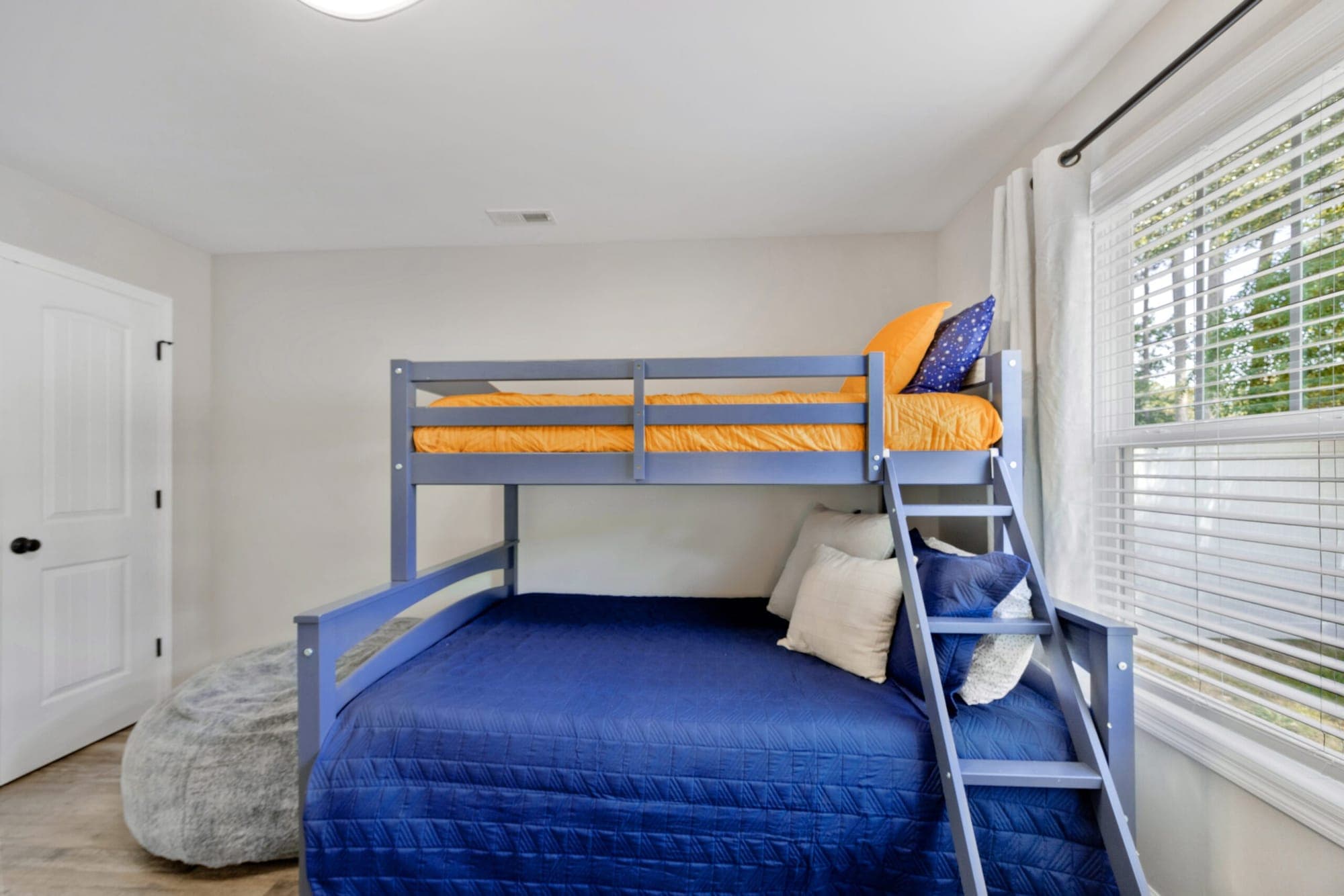 Bunk room with a bunk bed and bean bag