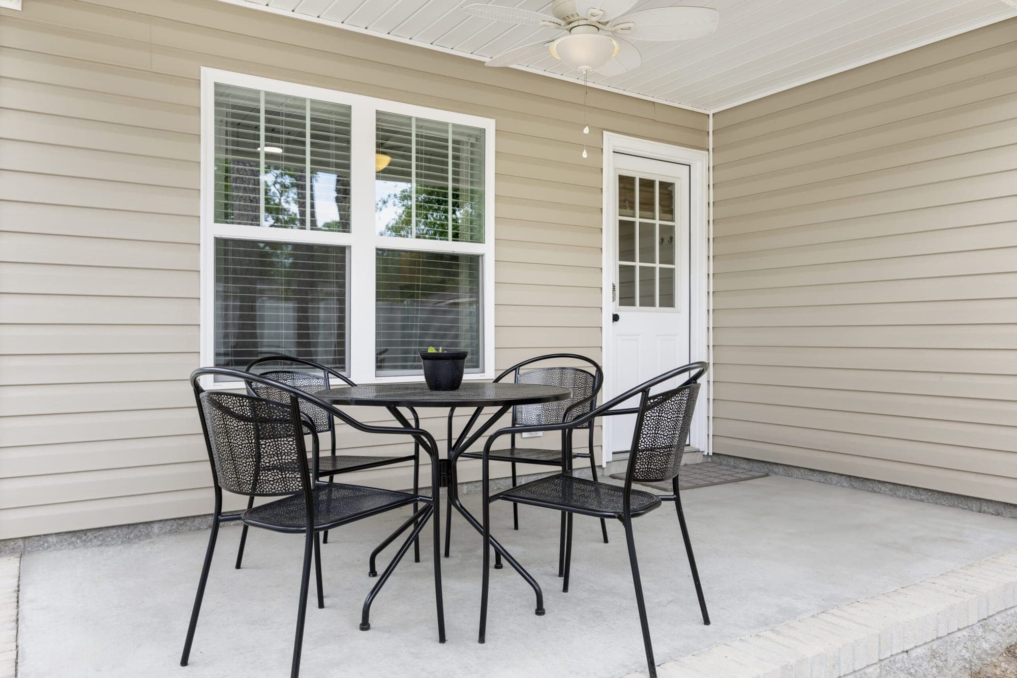 Outdoor dining table on the covered patio