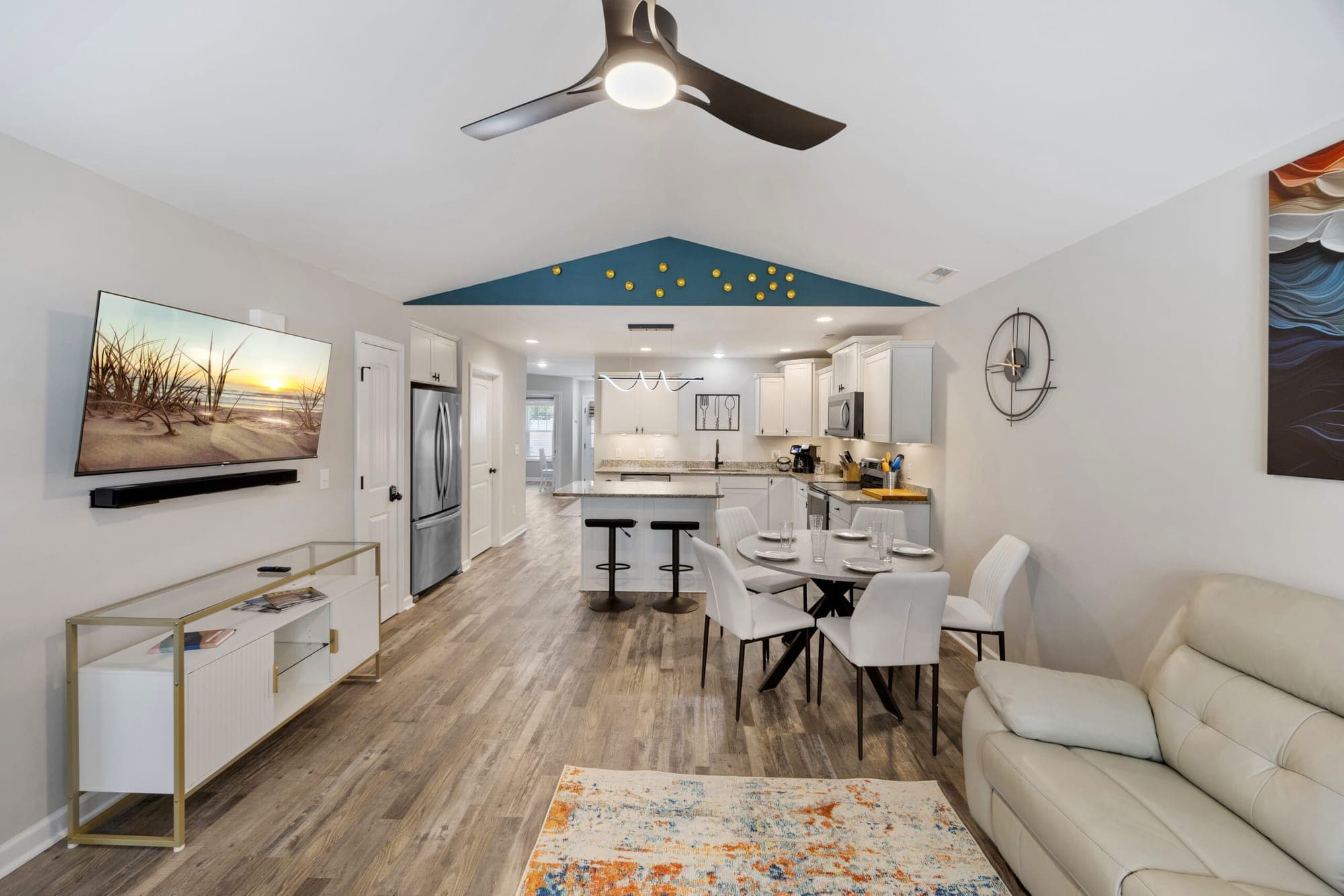 Great room with a TV, looking toward the kitchen