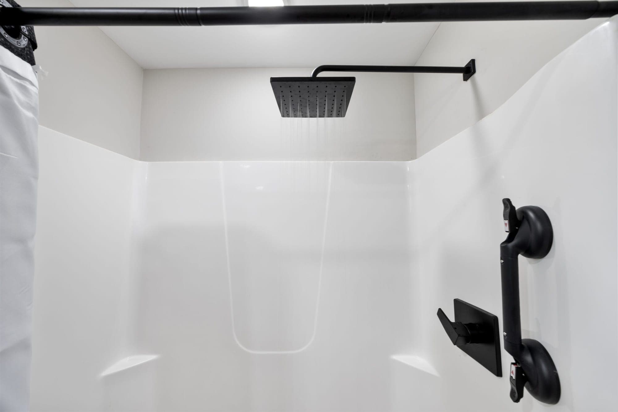 Walk-in shower with a rain shower head